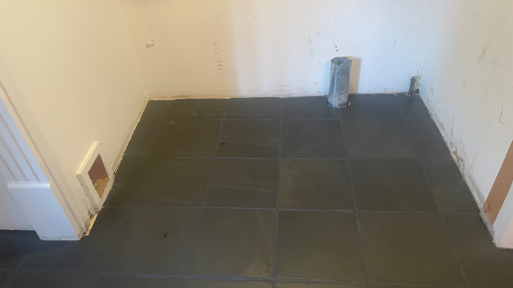 No need to replace this slate floor. It looks great